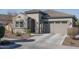 Single-story home with a two-car garage and well-manicured landscaping at 10950 N 184Th Dr, Surprise, AZ 85388