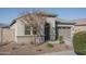 Single-story home with attached garage and landscaping at 10950 N 184Th Dr, Surprise, AZ 85388