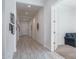 Bright hallway with tile flooring and access to other rooms at 10950 N 184Th Dr, Surprise, AZ 85388