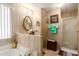 Clean bathroom with shower, bathtub, and updated vanity at 11411 N 91St Ave # 131, Peoria, AZ 85345