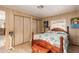 Bedroom with wooden bed frame and closet at 11411 N 91St Ave # 131, Peoria, AZ 85345