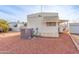 Rear view of the mobile home, showcasing the AC unit at 11411 N 91St Ave # 131, Peoria, AZ 85345