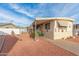 Single-wide manufactured home with carport and landscaped yard at 11411 N 91St Ave # 131, Peoria, AZ 85345