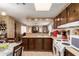 Kitchen with wood cabinets and modern appliances at 11411 N 91St Ave # 131, Peoria, AZ 85345