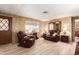 Living room with leather furniture and a view of the entrance at 11411 N 91St Ave # 131, Peoria, AZ 85345