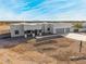 Modern desert home with a three-car garage and large lot at 12093 W Blackhawk Rd, Casa Grande, AZ 85194