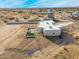 Aerial view of a house with a backyard patio and artificial turf at 12093 W Blackhawk Rd, Casa Grande, AZ 85194