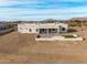 Aerial view of a house with a large backyard patio and artificial turf at 12093 W Blackhawk Rd, Casa Grande, AZ 85194