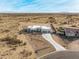 Aerial view of a house with a long driveway and desert landscape at 12093 W Blackhawk Rd, Casa Grande, AZ 85194