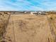 Aerial view of a house with a large backyard in a desert setting at 12093 W Blackhawk Rd, Casa Grande, AZ 85194