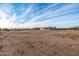 Expansive backyard with a view of the property from behind at 12093 W Blackhawk Rd, Casa Grande, AZ 85194