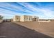 View of the home's back and side, highlighting the backyard space at 12093 W Blackhawk Rd, Casa Grande, AZ 85194