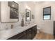 Modern bathroom with double vanity and walk-in shower at 12093 W Blackhawk Rd, Casa Grande, AZ 85194