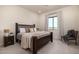 Bright bedroom with a king-size bed and mountain views at 12093 W Blackhawk Rd, Casa Grande, AZ 85194