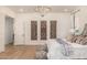 Main bedroom with wood floors and large windows at 12093 W Blackhawk Rd, Casa Grande, AZ 85194