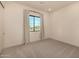 Bright bedroom with large window at 12093 W Blackhawk Rd, Casa Grande, AZ 85194