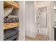 Custom shelves for linens and storage in bedroom hallway at 12093 W Blackhawk Rd, Casa Grande, AZ 85194