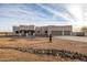 Modern house exterior with stucco finish and two-car garage at 12093 W Blackhawk Rd, Casa Grande, AZ 85194