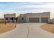 Modern stucco home with three-car garage and desert landscaping at 12093 W Blackhawk Rd, Casa Grande, AZ 85194