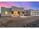 Modern home with a three-car garage and covered entryway at 12093 W Blackhawk Rd, Casa Grande, AZ 85194