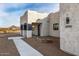 Craftsman style home with stone accents and desert landscaping at 12093 W Blackhawk Rd, Casa Grande, AZ 85194