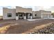 Modern home with a covered entryway and two-car garage at 12093 W Blackhawk Rd, Casa Grande, AZ 85194