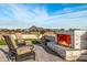 Relaxing firepit with seating area and landscaping at 12093 W Blackhawk Rd, Casa Grande, AZ 85194