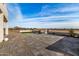 Outdoor stone fireplace on flagstone patio at 12093 W Blackhawk Rd, Casa Grande, AZ 85194