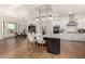 Modern kitchen with white cabinets, large island, and stainless steel appliances at 12093 W Blackhawk Rd, Casa Grande, AZ 85194