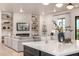 Modern kitchen island with white quartz countertop at 12093 W Blackhawk Rd, Casa Grande, AZ 85194