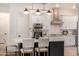 Modern kitchen with white cabinets, stainless steel appliances, and a gas cooktop at 12093 W Blackhawk Rd, Casa Grande, AZ 85194