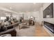 Bright living room with sectional sofa and fireplace at 12093 W Blackhawk Rd, Casa Grande, AZ 85194