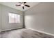 Well-lit bedroom with wood-look floors and ceiling fan at 13434 W Jacobson Dr, Litchfield Park, AZ 85340