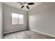 Bright bedroom with window and ceiling fan at 13434 W Jacobson Dr, Litchfield Park, AZ 85340