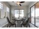 Dining room with round table and four chairs near sliding glass doors at 13434 W Jacobson Dr, Litchfield Park, AZ 85340