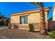 Landscaped side yard with gravel and a palm tree at 13434 W Jacobson Dr, Litchfield Park, AZ 85340