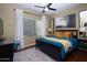 Bedroom with a plush bed and modern ceiling fan at 1351 N Pleasant Dr # 1118, Chandler, AZ 85225