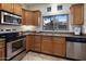 Modern kitchen with stainless steel appliances and ample cabinetry at 1351 N Pleasant Dr # 1118, Chandler, AZ 85225