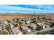 Aerial view of a residential neighborhood with houses and open fields at 1358 E Jardin Dr, Casa Grande, AZ 85122