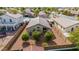 Aerial view of a house with backyard, trees, and a block wall at 1358 E Jardin Dr, Casa Grande, AZ 85122