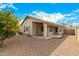 Backyard with covered patio and gravel landscaping at 1358 E Jardin Dr, Casa Grande, AZ 85122