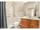 Clean bathroom with shower, toilet and wood vanity at 1358 E Jardin Dr, Casa Grande, AZ 85122