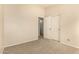 Bedroom with carpet flooring and double doors to bathroom at 1358 E Jardin Dr, Casa Grande, AZ 85122