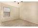 Spacious bedroom featuring ceiling fan and carpet at 1358 E Jardin Dr, Casa Grande, AZ 85122