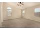 Spacious bedroom with carpeted floors and ceiling fan at 1358 E Jardin Dr, Casa Grande, AZ 85122