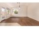 Bright dining room features wood-look floors and large windows at 1358 E Jardin Dr, Casa Grande, AZ 85122