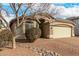 House with a large front yard and drought-tolerant landscaping at 1358 E Jardin Dr, Casa Grande, AZ 85122