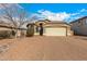 One-story home with a brick driveway and desert landscaping at 1358 E Jardin Dr, Casa Grande, AZ 85122