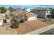 Single-story house with a driveway and mature tree in front at 1358 E Jardin Dr, Casa Grande, AZ 85122