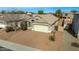 Single-story home with a two-car garage and desert landscaping at 1358 E Jardin Dr, Casa Grande, AZ 85122